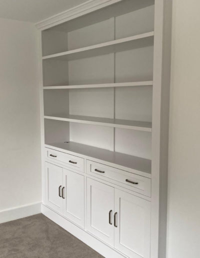 Fitted Bookcase With Drawers & Cupboards. Finished in Ice White