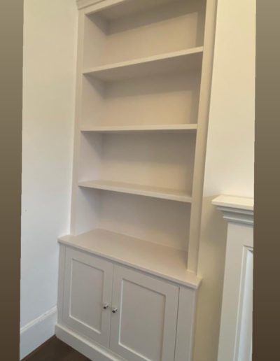 Fitted Bookcase with Doors. Finished in Ice White