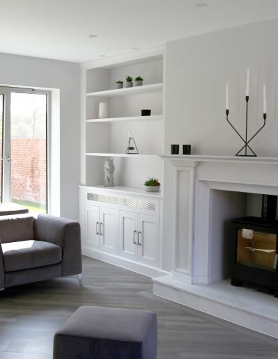 Fitted Alcove Unit with Cupboards and Shelving. Painted in Ice White