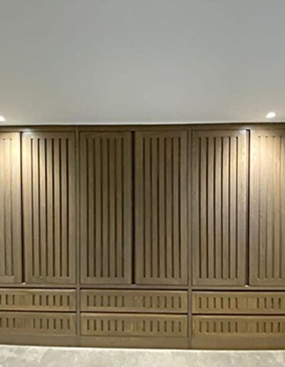 Oak wardrobe with recessed handles finished in grey oil