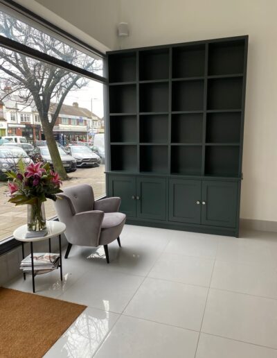Unique shaker style product display unit for The Strand Group Shenfield in their salon reception area, finished in Farrow & Ball studio green paint