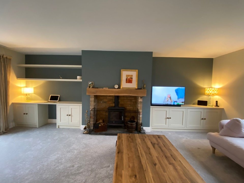 Two shaker style alcove units & floating shelves with a desk one side & media cabinet on the other finished in farm house white