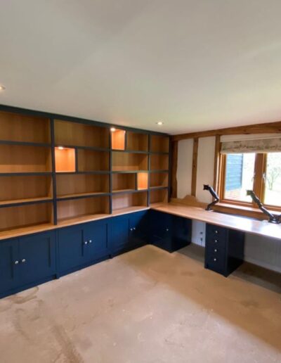 Shaker style home office unit, solid oak tops, curved shelve ends, soft close openings, remote led lights finished in Farrow & Ball Hague