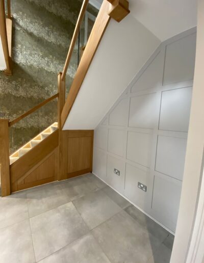 oak understairs cupboards to match the stairs & panelled wall in Farrow & Ball cornforth white