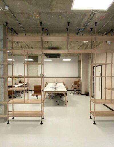 Solid oak unique office display units to Space Shack Interior’s specific design. Fitted around the concrete pillar in lime wash finish