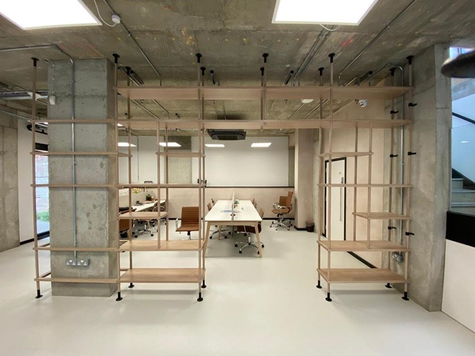 Solid oak unique office display units to Space Shack Interior’s specific design. Fitted around the concrete pillar in lime wash finish