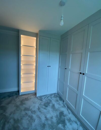 Bespoke 4 panel shaker style dressing room unit with feature remote sensor lights & illuminated shoe & bag