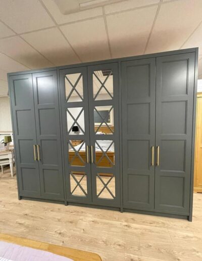 Bespoke 4 panel shaker style wardrobe for our showroom Centre fret mirror doors, Lissa oak internals, Hafele handles, internal lights, finished in Farrow and Ball down pipe paint