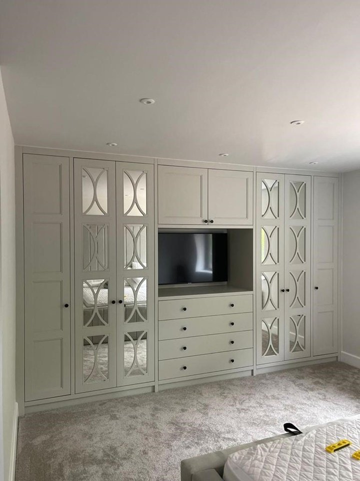 bespoke master bedroom 4 door mirrored fret design wardrobe with space for a TV bespoke master bedroom 4 door mirrored fret design wardrobe with space for a TV