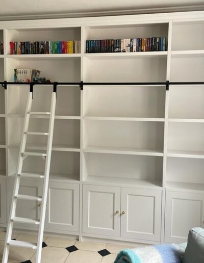 Unique 4.5 wide & 2.8 m tall bookcase with a ladder & rail detailed shaker doors & finished in white paint
