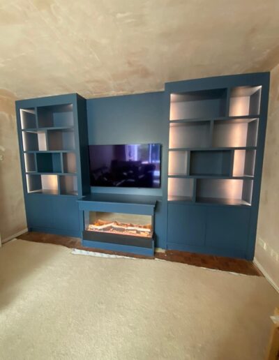 Bespoke media unit with fireplace LED lights finished in Farrow and Ball stiffkey blue