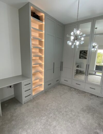 Bespoke 3m high dressing room unit with internals FinsaUK nogal Siena, shoe display with remote lights soft runner drawers, corner unit doors with 150 degree hinges for total accessibility