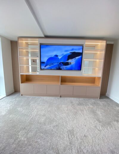 Bespoke media unit with oak acoustic end panels & centre section, mirror backs & feature LED remote lights. Finished in Farrow & Ball two tone paint