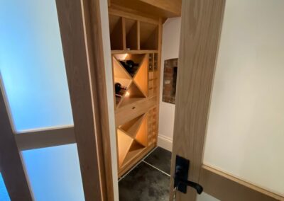 Doors were designed & fitted to section off the wine rack to make a dedicated wine room.