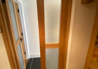 Open internal solid oak door with frosted glass