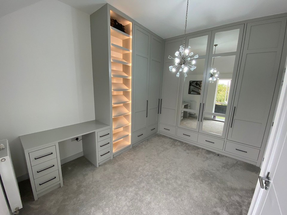 Bespoke 3m high dressing room unit with internals FinsaUK nogal Siena, shoe display with remote lights soft runner drawers, corner unit doors with 150 degree hinges for total accessibility