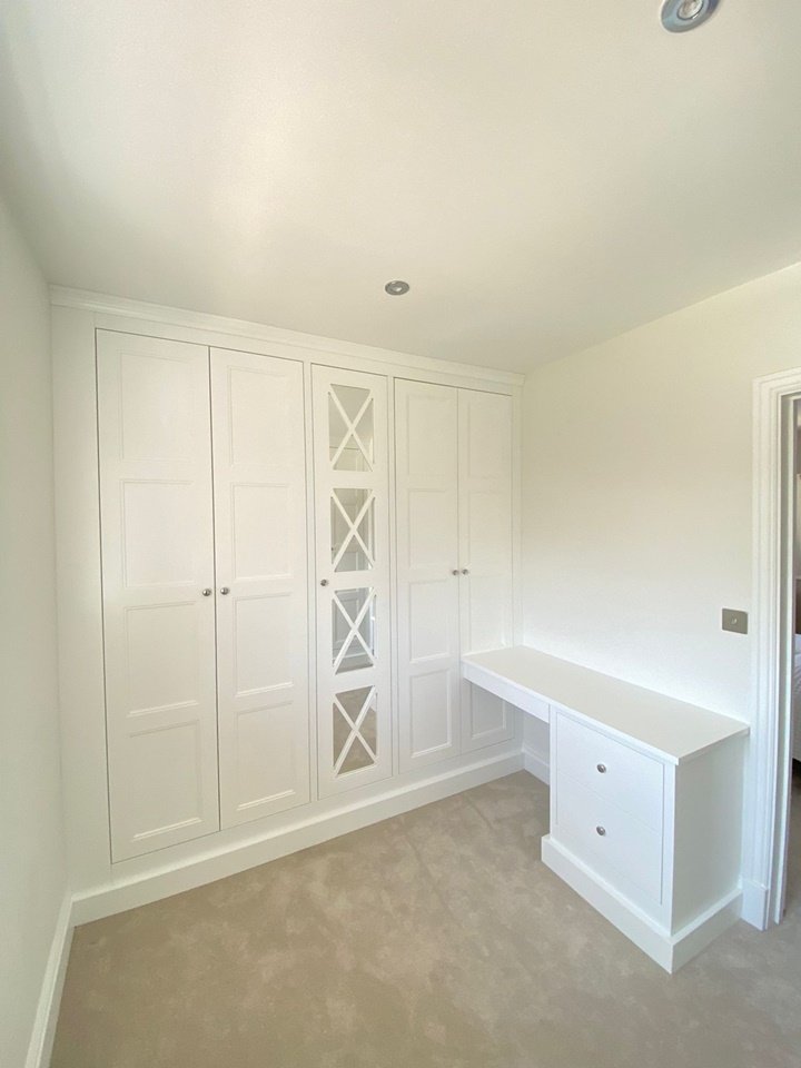 Dressing-room-install-panelled-wardrobe-with-fret-mirrored-doors