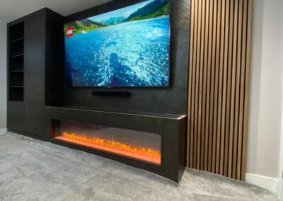 Media unit with cupboard & shelving storage, a fire surround for an integrated plasma fireplace plus a feature oak acoustic board