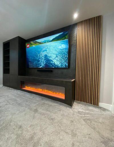 Media unit with cupboard & shelving storage, a fire surround for an integrated plasma fireplace plus a feature oak acoustic board