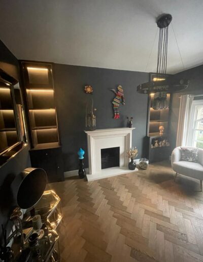 Alcove units with fluted backs to match existing glass doors, feature LED shelve lights & solid brass strips in the top sections, finished in Farrow & Ball railing paint