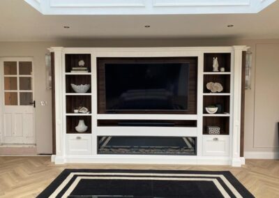 Bespoke media unit with TV, sound bar and plasma fire surround