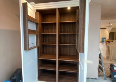 Bespoke pantry unit with walnut internals