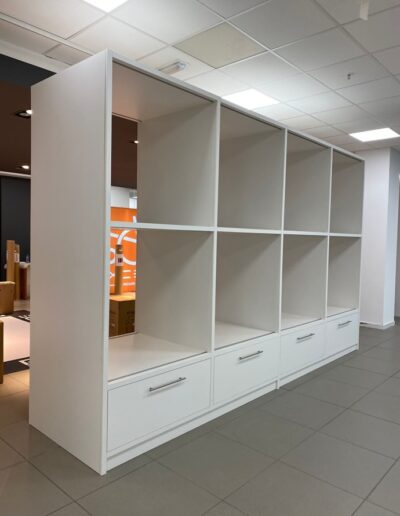 Custom-made wheelchair display units for Lifestyle & Mobility 2.7m tall x 4.2m wide made from white matt laminated sheets with strip lights and soft close drawers