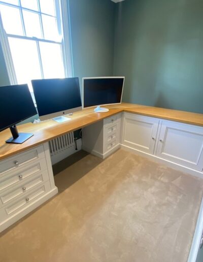 Bespoke office unit with detailed shaker style drawers and doors and solid oaks tops finished in ice white paint