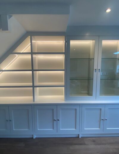Custom-made shaker-style dining room display unit, oak internals on the base section, soft close doors, feature LED lights finished in Dulux Dutch white paint