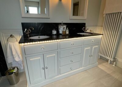 Vanity unit with oak internals, soft close doors & drawers, painted finish to coordinate with their bathroom, with stone top