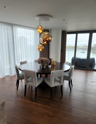 Bespoke table made in our onsite workshop with a 2-metre round by 50mm thick top on pedestal base, finished in wenge dark oak