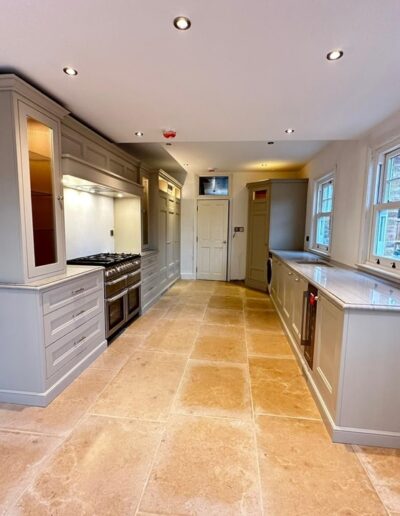 New kitchen install: Shaker-style cabinets finished in Farrow & Ball's 'Dropcloth' with polished chrome handles and integrated Miele appliances & a Range cooker.