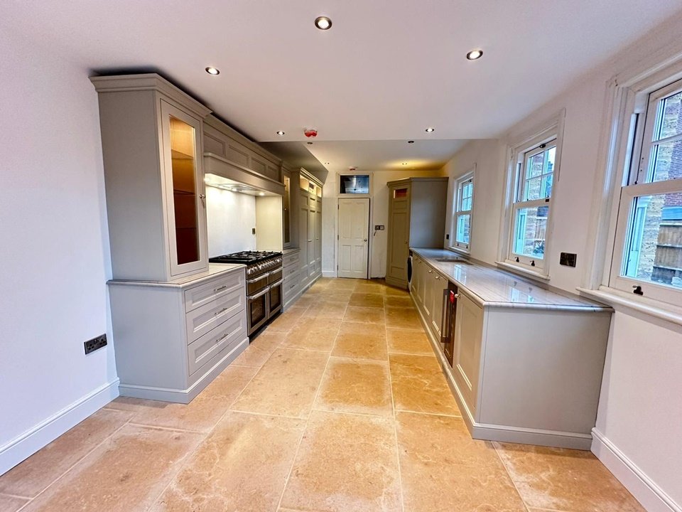 New kitchen install: Shaker-style cabinets finished in Farrow & Ball's 'Dropcloth' with polished chrome handles and integrated Miele appliances & a Range cooker.