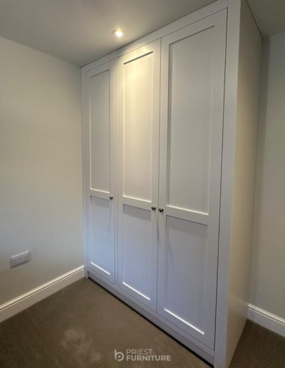 Bespoke 3-door classic Shaker-style wardrobe with oak internals finished in-house colour Ice White
