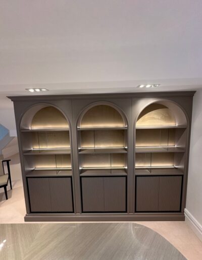 Custom-made display unit LED backlit glass, brass hinges and knobs plus quartz top. Colour Matched to existing furniture