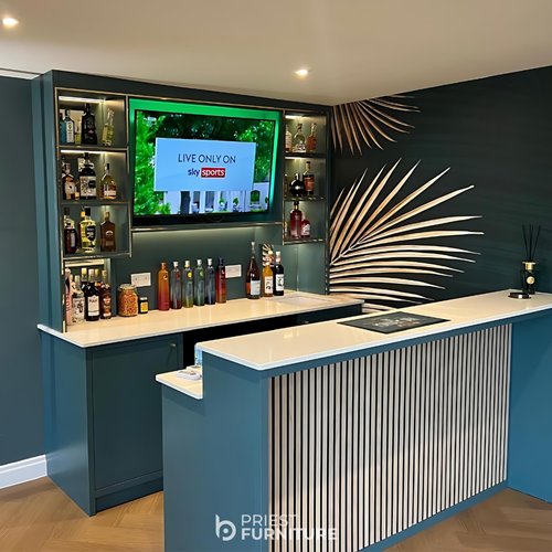 Custom bar unit for our client’s outbuilding, Painted in the "Inchyra Blue" by Farrow & Ball, this fitted bar is manufactured with timber from Brooks Brothers and FINSA oak internals, LED lighting supplied by Hafele, acoustic paneling from The Wood Veneer Hub and a stone worktop by G-Stone.
