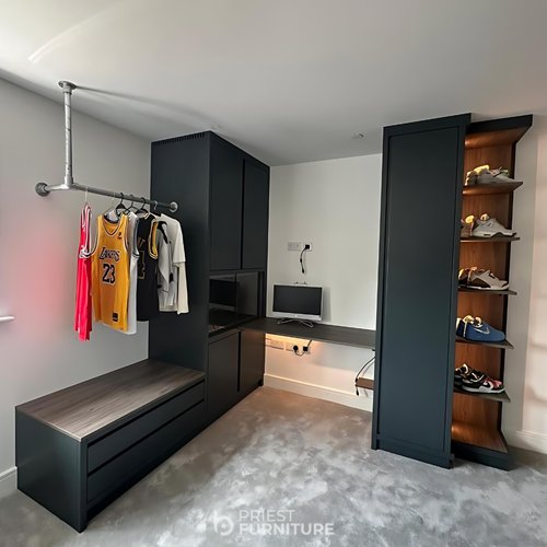 with fitted wardrobes, desk, chest of drawers and integrated vivarium finished in Farrow and Balls Hopper Head