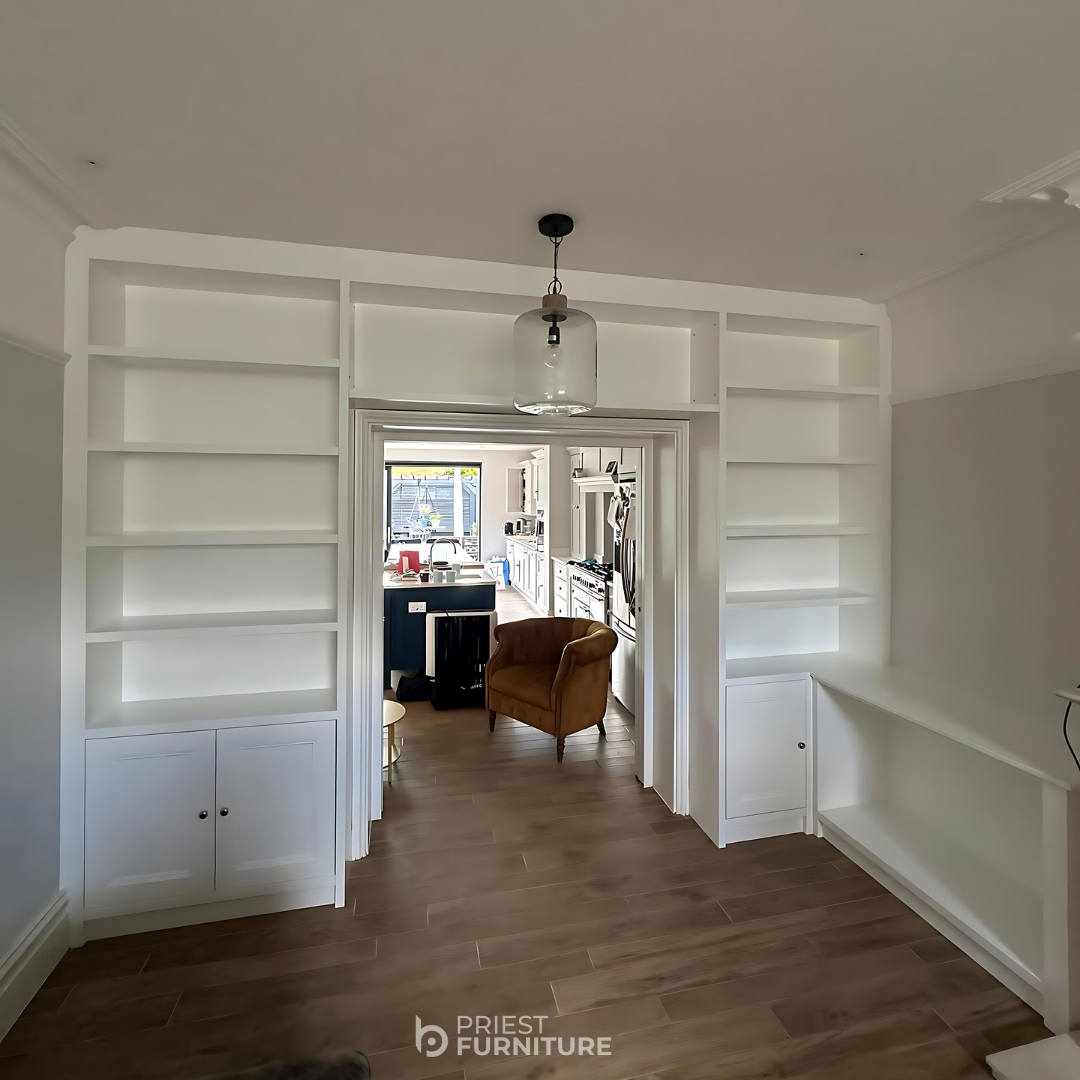 Custom made curved bookcases with molded arches, Atelier Ellis Totara finish, exterior coated in Farrow and Ball Setting Plaster Paint