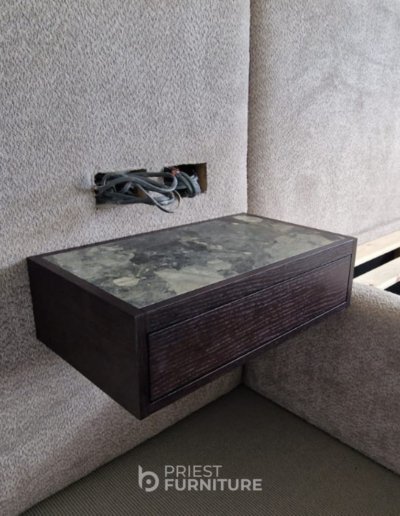 Bespoke floating bedsides in grained dark oak with marble top