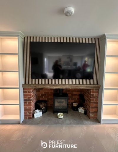 Custom media unit installed to our clients home featuring open shelving, painted in French Mid Grey by Little Green. Complete with LED lights an an acoustic back panel in contemporary oak