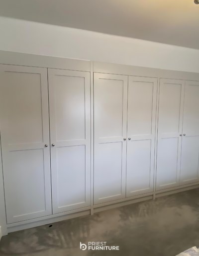 Bespoke fitted Shaker-style wardrobes in Morning Dew