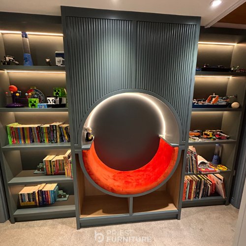 Bespoke reading snug and shelving unit with LED lighting, sprayed in "Inchrya Blue" by Farrow & Ball